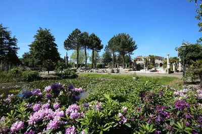 a garden with purple flowers in a park at Boutique Villa De Zuilen in Hillegom