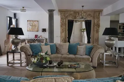 a living room with a couch and a table at Boutique Villa De Zuilen in Hillegom