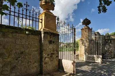 an iron gate with a vase on top of it at Boutique Villa De Zuilen in Hillegom