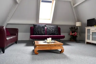 a living room with a couch and a coffee table at Amsterdam Farmland in Amsterdam