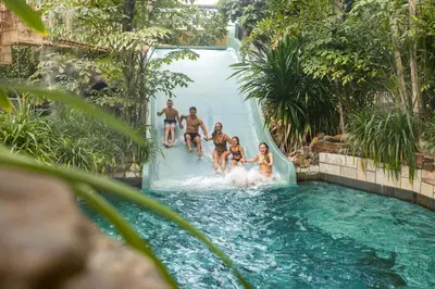 a group of people on a water slide at Hotel Eemhof by Center Parcs in Zeewolde