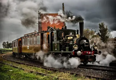 a steam engine train is traveling down the tracks at Middelpunt Opmeer in Opmeer