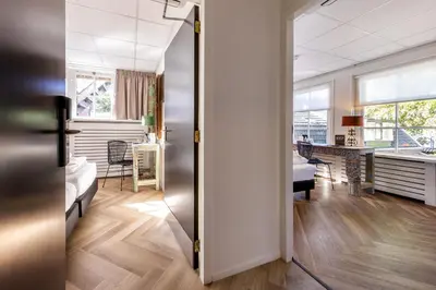 an open door to a living room and a dining room at Broeck Oudewater in Oudewater