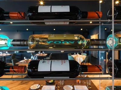 a bunch of bottles of wine on a shelf at Appartement Aqua in Oude Wetering