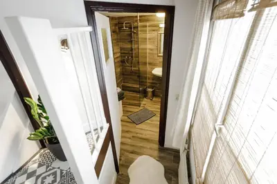 a bathroom with a walk in shower next to a toilet at Aris Amsterdam in Amsterdam