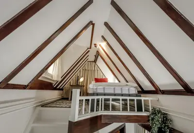 a bedroom with a bed in a loft at Aris Amsterdam in Amsterdam