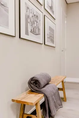 a wooden table with a blanket on top of it at Millsight in Uitgeest