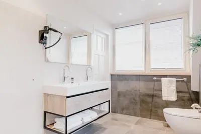 a bathroom with a sink and a toilet at Millsight in Uitgeest