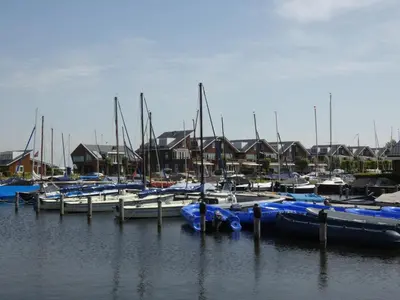 a group of boats docked in a marina at Apartment Penthouse by Interhome in Uitgeest