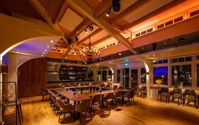 a large dining room with a long table and chairs at Thalassa Beach Houses in Zandvoort