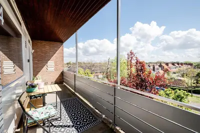 an outdoor balcony with a view of a city at Amsterdam Beach Apartment 44 in Zandvoort