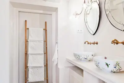 a bathroom with a sink and a mirror at Luna's Hideaway in Amsterdam