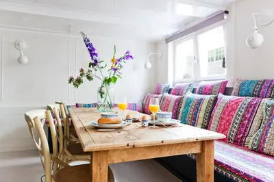 a dining room with a table and a couch at Luna's Hideaway in Amsterdam