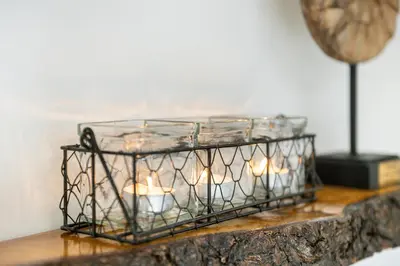 a candle holder with candles in it on a table at Cottage 44 - Free parking! in Zandvoort