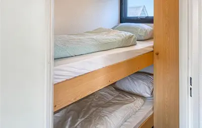a bedroom with two bunk beds in a room at Lake Front Home In Breukelen in Breukelen