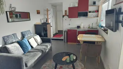 a living room with a couch and a table at Goody in Zandvoort
