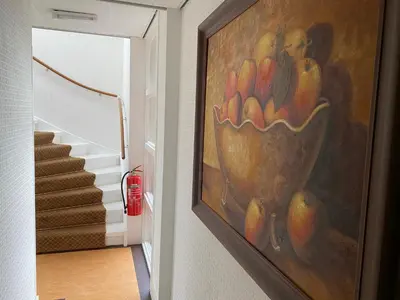 a painting of a bowl of fruit on a wall at Villa Prinsenhof # Twaalf in Bergen