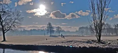 a person riding a bike in a snow covered field at Villa Prinsenhof # Vierendertig in Bergen
