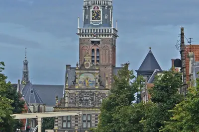 a large building with a clock tower on top of it at Villa Prinsenhof # Vierentwintig in Bergen