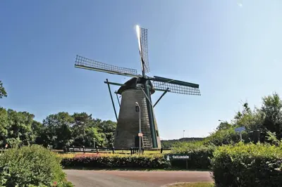 a windmill on the side of a road at Villa Prinsenhof # Zeventien in Bergen
