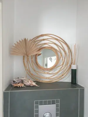 a mirror sitting on top of a shelf with at Little Lodge Noordwijk aan Zee in Noordwijk