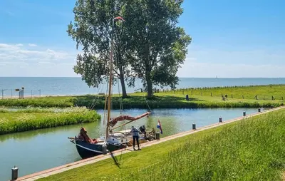 a boat on a river with a slide at Lovely Home In Wijdenes With Wifi in Wijdenes