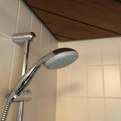 a shower head in the corner of a bathroom at Schoorl Seasons Garden House 2026 in Schoorl