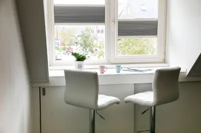 two chairs sitting in front of a window at B&B Hartje Spakenburg in Spakenburg