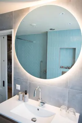 a bathroom with a sink and a mirror at RiverSide Suite - Haarlem City Centre in Haarlem
