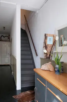 a hallway with a staircase and a stair case at RiverSide Suite - Haarlem City Centre in Haarlem