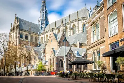 a large building with a clock tower in the background at RiverSide Suite - Haarlem City Centre in Haarlem