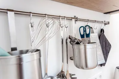 a bunch of utensils hanging on a wall at Beach Studio 35 with private parking in Zandvoort