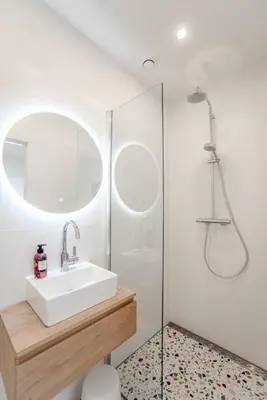 a bathroom with a sink and a shower at Beach Studio 35 with private parking in Zandvoort