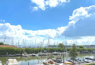 a bunch of boats docked in a marina at Who's Anton? Monnickendam, vlak bij Amsterdam in Monnickendam