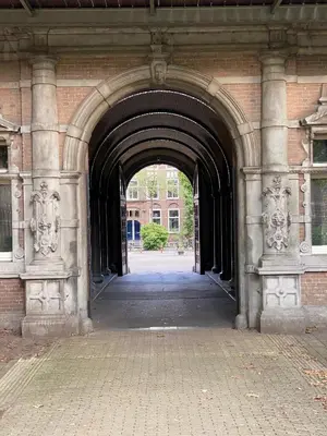 an entrance to a brick building with an archway at Dreamtime Houseboat in Amsterdam