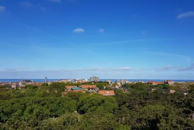 a view of a city from the top of a hill at 'Heerlijk Zomerhuis Vlakbij Strand en Duinen' in Egmond aan Zee