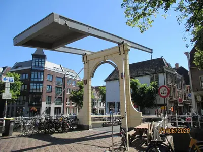 an arch in the middle of a street with bicycles at Vakantiehuis Friedeburg in Warmenhuizen