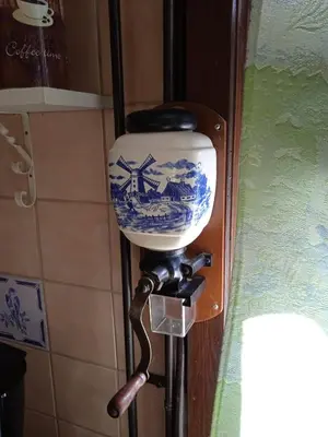 a light attached to a wall with a door at Vakantiehuis Friedeburg in Warmenhuizen