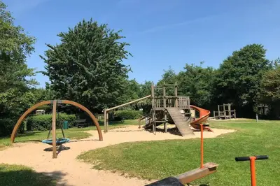 a playground with a slide in a park at Chalet Bergen NH, Schoorl, Schoorldam in Warmenhuizen