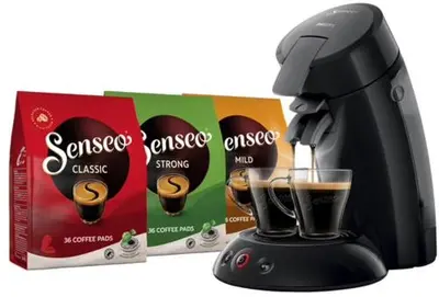 a black coffee maker next to a box of cookies at Chalet Bergen NH, Schoorl, Schoorldam in Warmenhuizen