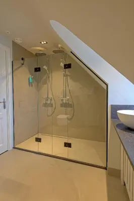 a glass shower in a bathroom with a sink at Grandcafé Boutique Hotel Eemland in Eemnes