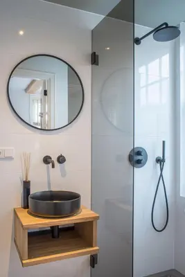 a bathroom with a sink and a shower at Studios at the canal in Amsterdam