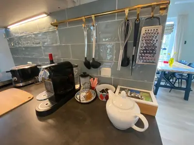 a kitchen counter with a coffee maker and a tea kettle at Park View Apartment in Amsterdam