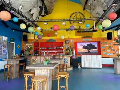 a restaurant with a table and stools in a room at Holiday Home Campi 400 by Interhome in Uitgeest