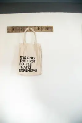 a tote bag hanging on a wall at Bed and Wine Nonsolovino in Reeuwijk