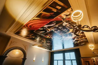 a painting on the ceiling of a room at Boutique Hotel The Noblemen in Amsterdam