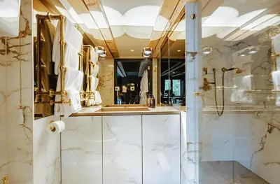 a bathroom with a sink and a shower at Boutique Hotel The Noblemen in Amsterdam