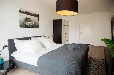 a bedroom with a large bed in a room at Modern Hideout Ace Location in Amsterdam