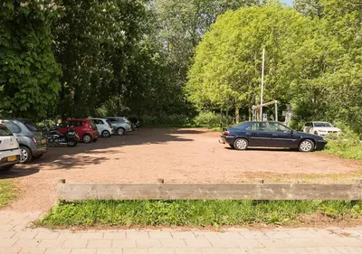 a bunch of cars parked in a parking lot at Slaperij ‘t Woud - Near the dunes and the sea! in Bergen