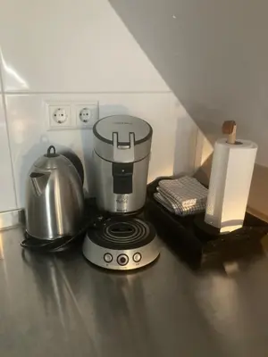 a coffee maker on a counter in a kitchen at B&BOosterweg3 Studio - Free private parking in Heemskerk